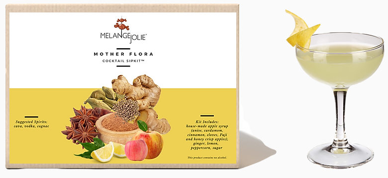 Mélange Jolie Mother Flora Cocktail SipKit™ with ingredients and glass, showcasing aromatic spices and dehydrated fruits.